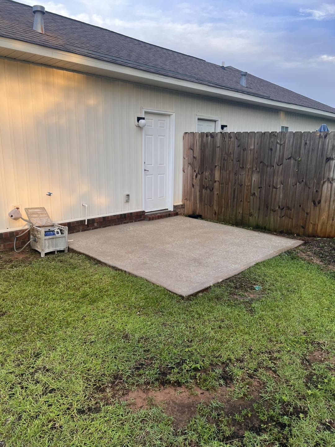 Clean patio and rear exterior after pressure washing